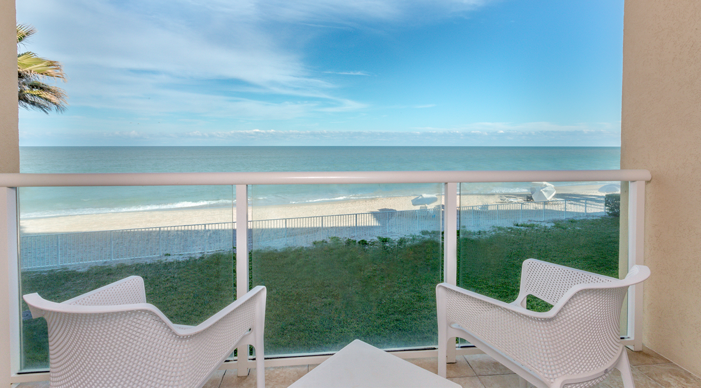 chairs on patio with look over the beach