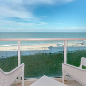 chairs on patio with look over the beach
