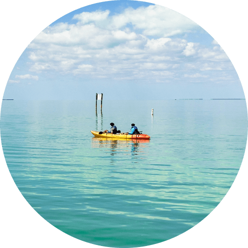 people in kayak in the ocean