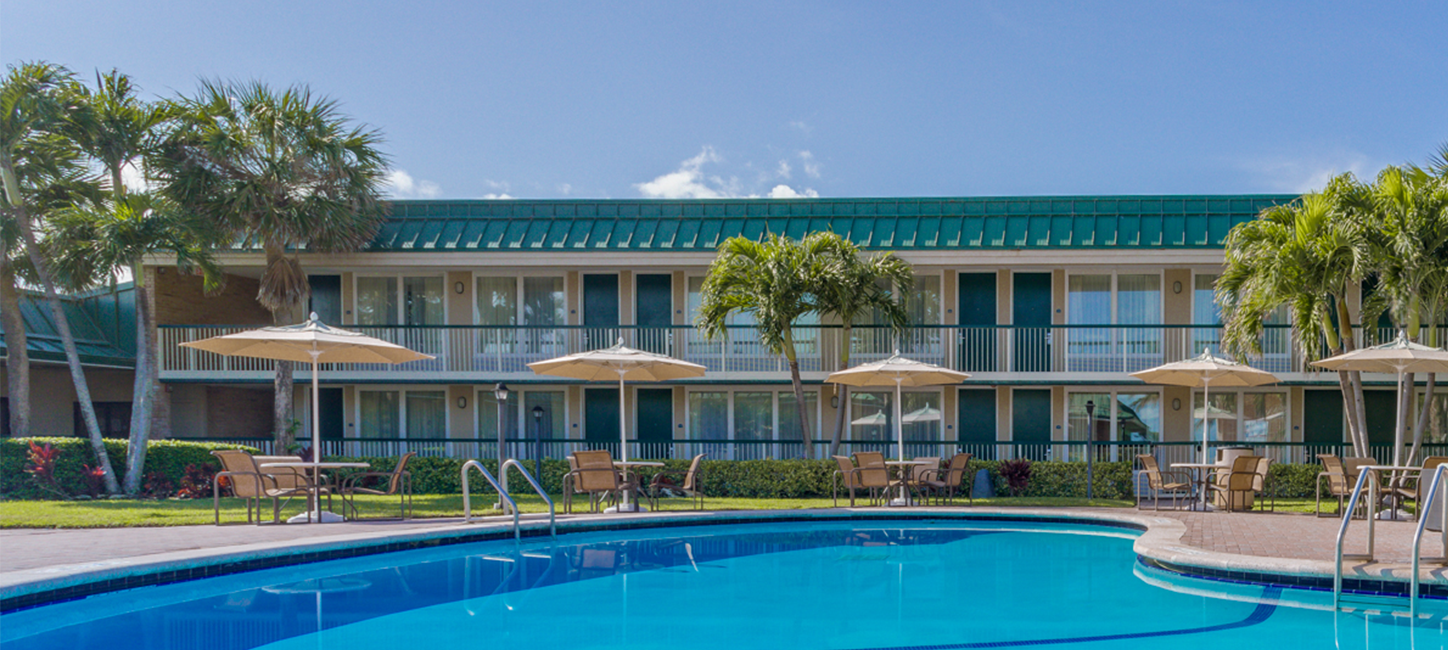 hotel pool with tables