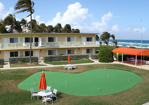 A lawn with a putting green.