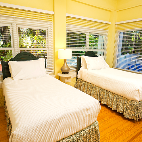 Two beds in a room.