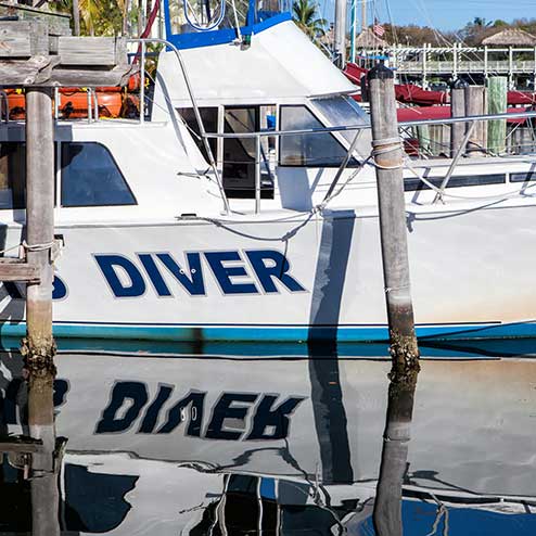 Close-up of a white boat named 