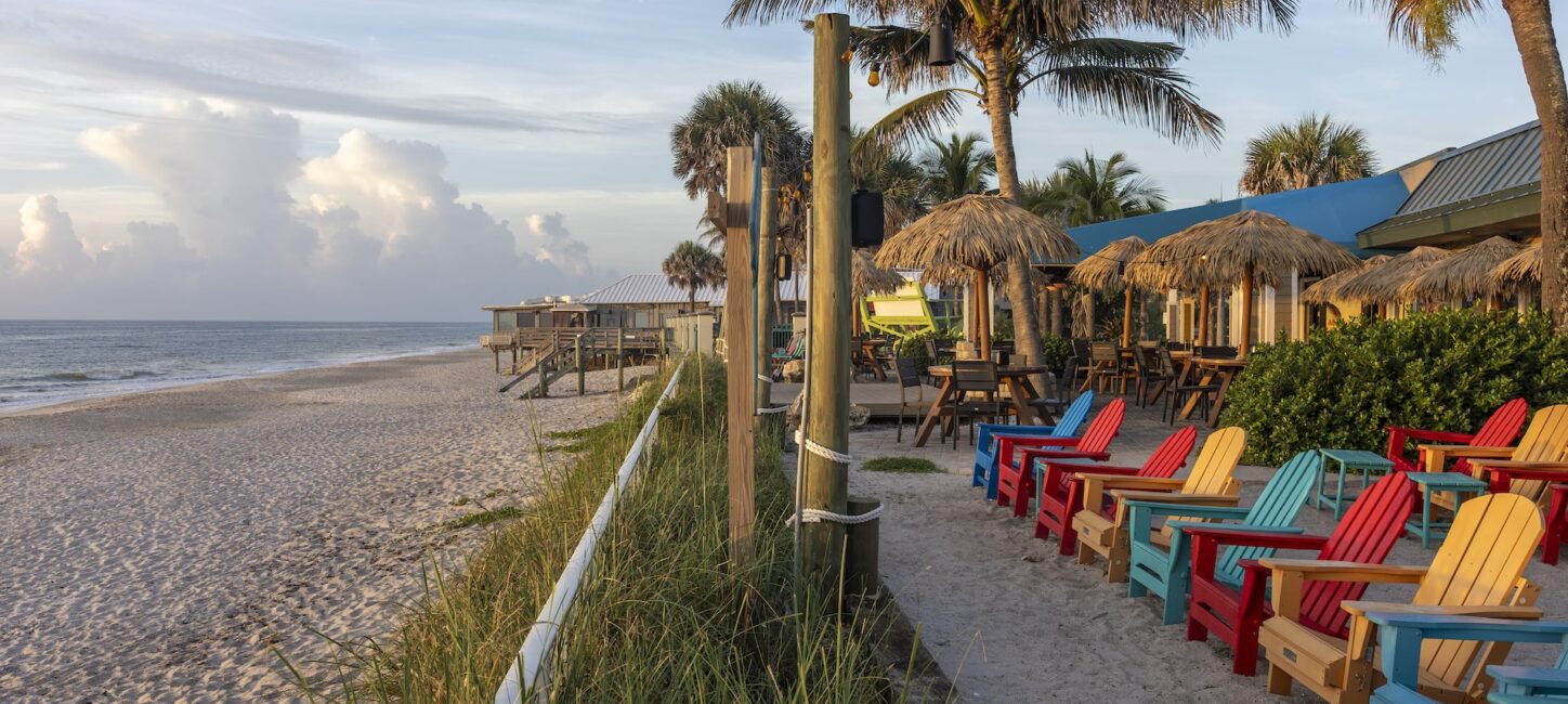 Mulligans restaurant beachfront patio with colorful adk chairs