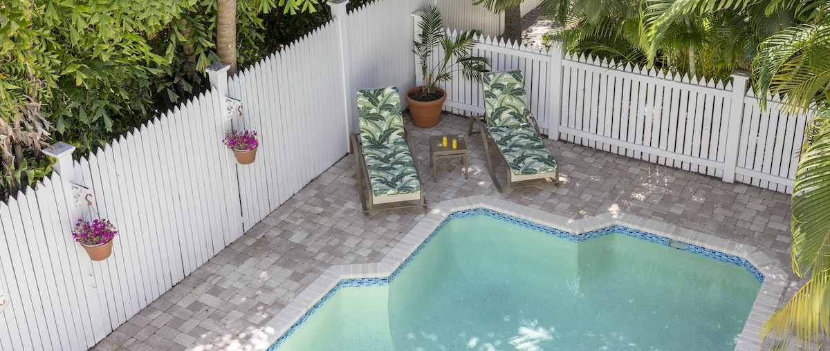Weatherstation Inn pool deck with two chairs
